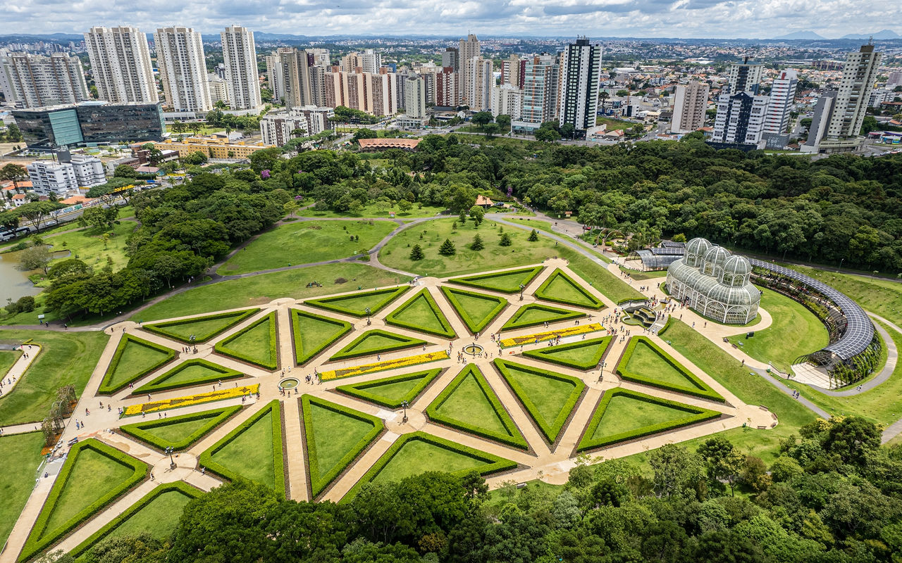 Aerial view of Curitiba with lush green parks and imposing modern architecture