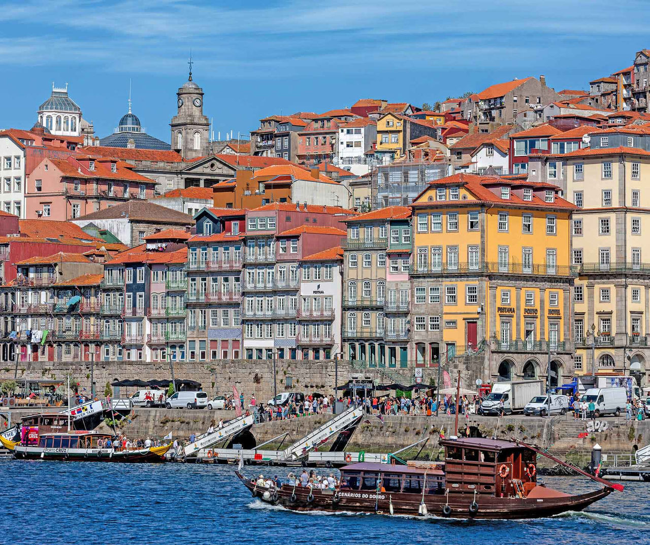Porto hotel overlooking colourful riverside buildings and traditional boats along the Douro waterfront