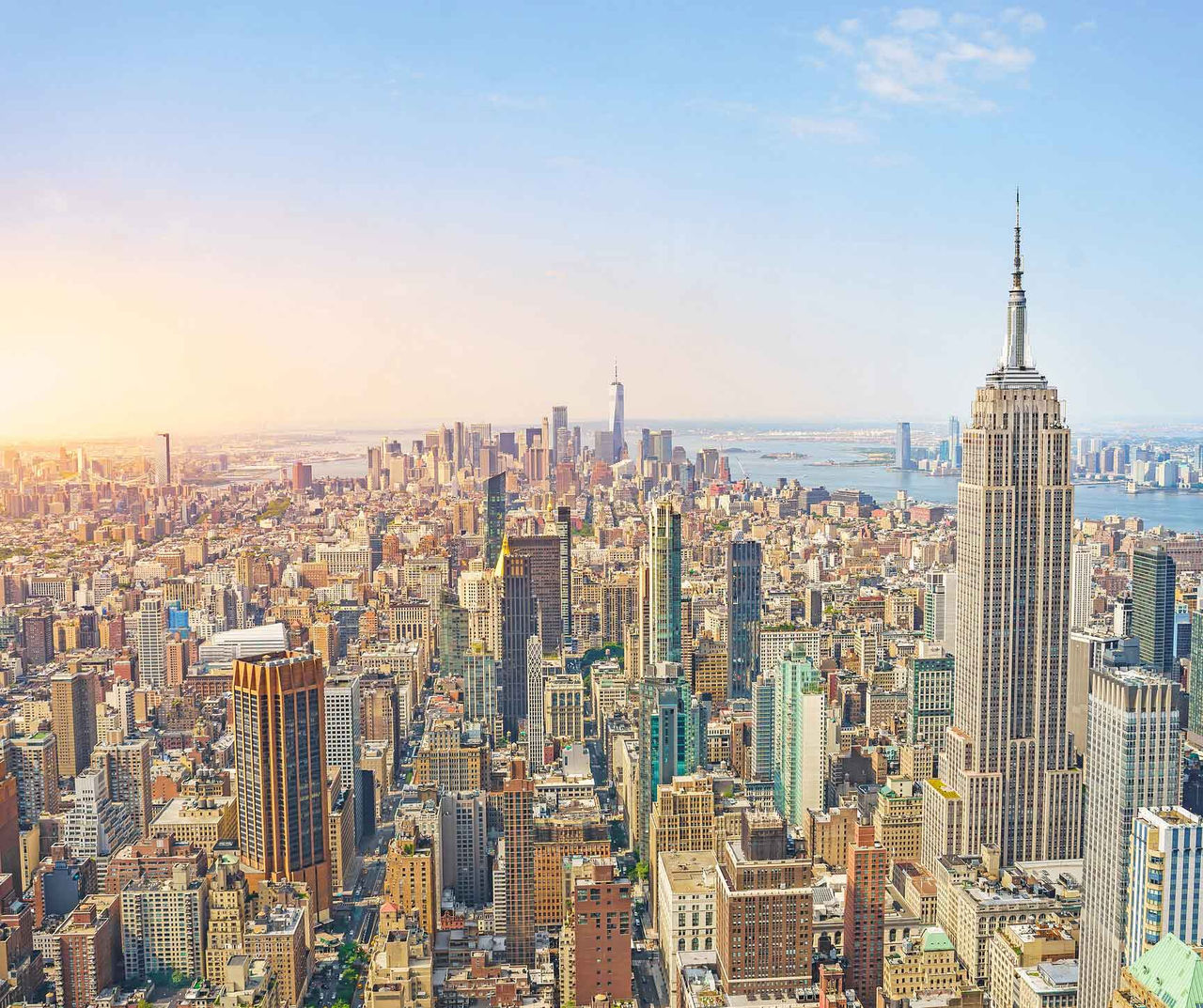 New York hotel featuring a panoramic skyline view with the Empire State Building and dense city streets