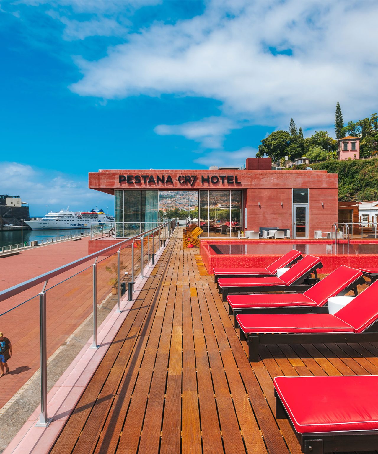 Pestana CR7 Funchal, the first hotel of the Pestana CR7 Lifestyle brand. It has a pink pool with a view of the Marina